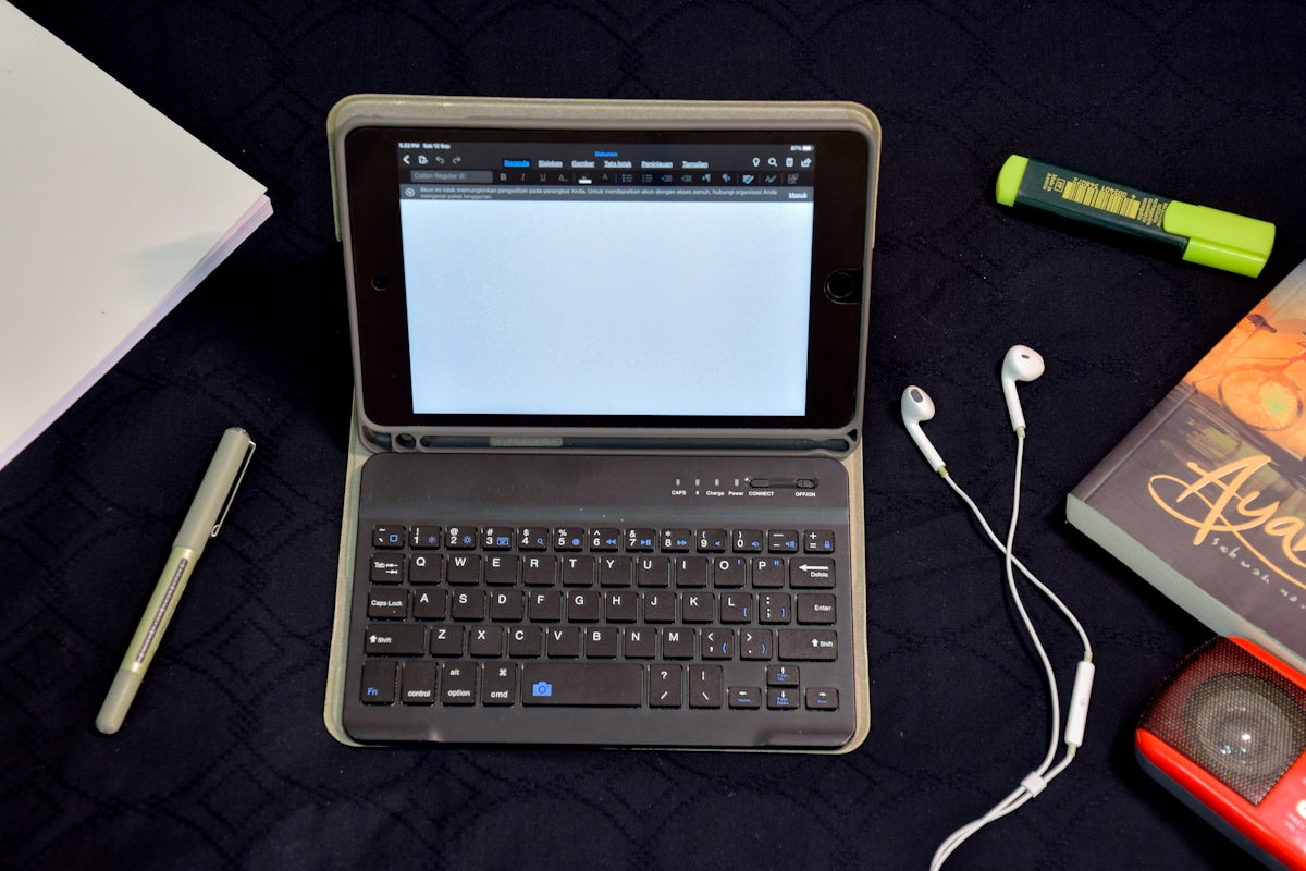 white samsung tablet computer with black smart keyboard