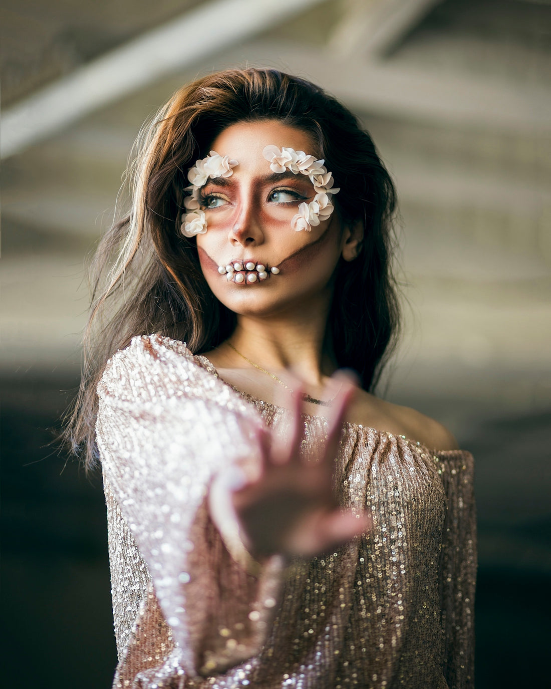 a woman with a skeleton make up on her face