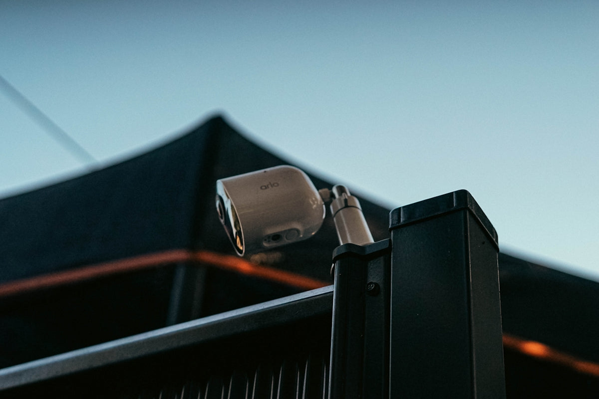 a security camera attached to a metal pole