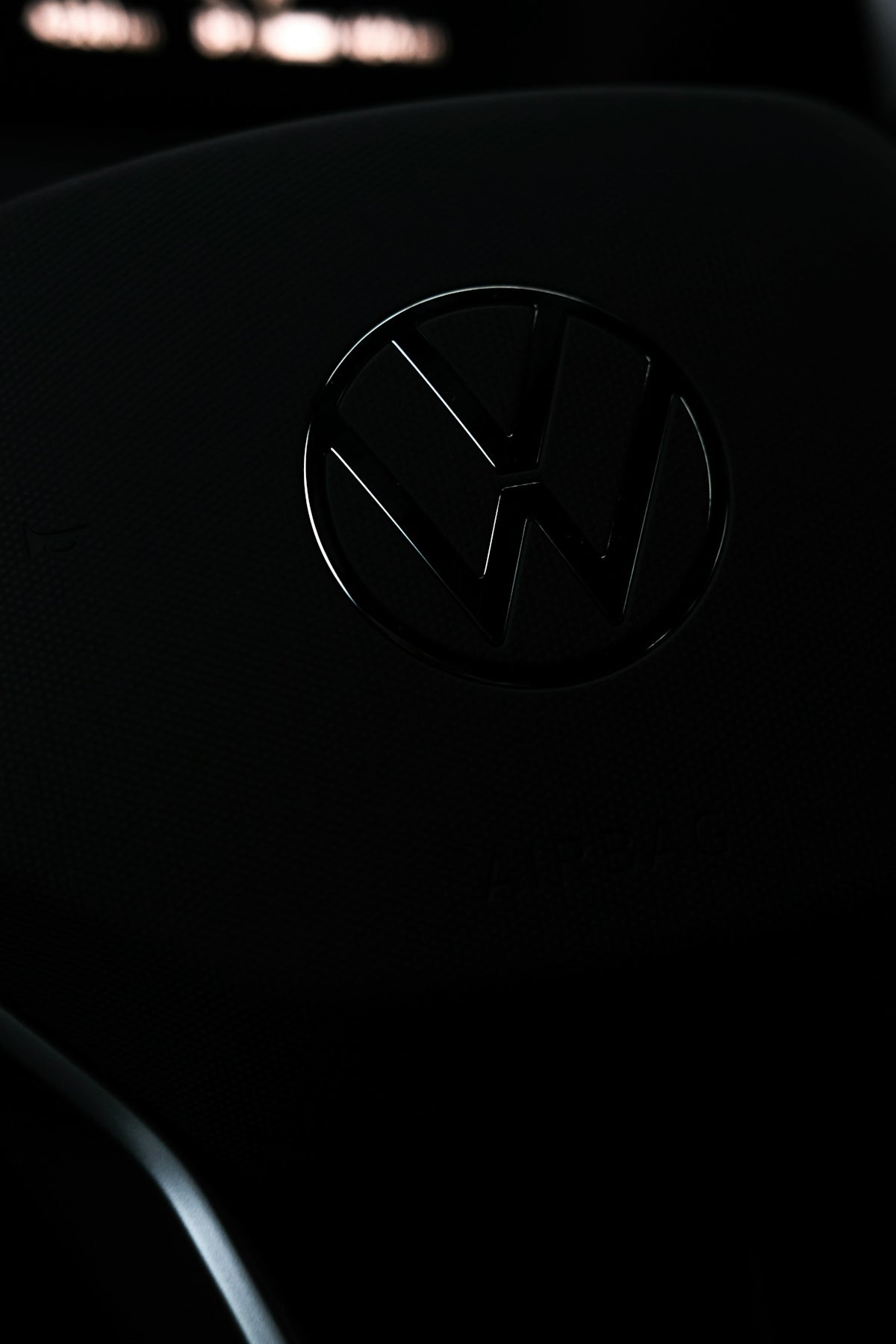 a close up of a volkswagen emblem on a car