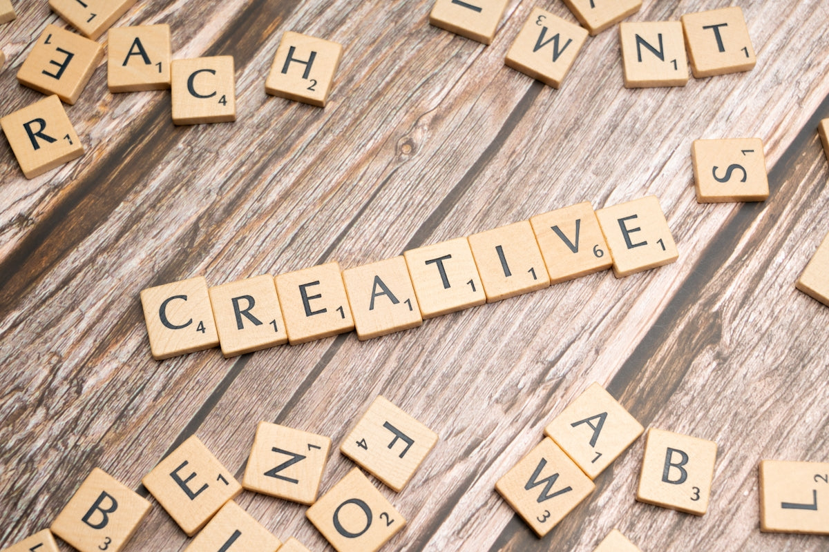scrabble tiles spelling out the word creative
