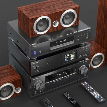 High quality audio systems featuring wood-finish speakers and black digital audio components with remote controls